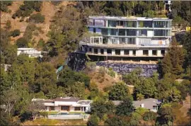  ?? Genaro Molina Los Angeles Times ?? THE UNFINISHED Bel-Air hillside mansion, spearheade­d by real estate developer Mohamed Hadid, is the focus of an ongoing legal battle with neighbors.