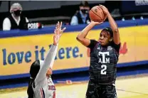  ?? Thomas Graning / Associated Press ?? Aaliya Wilson and the A&M women are ranked No. 3 with eyes on more, while the men have not even played since Jan. 30.