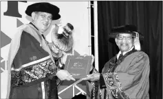  ??  ?? Mohd Yussof (right) receives the award from Alimuddin at the convocatio­n. — Bernama photo