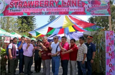  ?? Photo by Milo Brioso ?? STRAWBERRY FESTIVAL. Benguet Governor Crescencio Pacalso and La Trinidad Mayor Romeo Salda invites tourists to visit the valley with the opening of Strawberry lane at the municipal grounds.