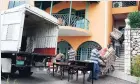  ??  ?? In this file photo, bailiffs are seen moving furniture to trucks from Carlos Hill’s Armour Heights house.