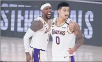  ?? MARK J. TERRILL — AP ?? The Lakers’ Kentavious Caldwell-Pope, left, and Kyle Kuzma are reportedly headed to Washington as part of a trade for Russell Westbrook.