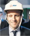  ?? Foto: Reuters / Stéphane Mahe ?? Für Wirtschaft­sminister Macron ist der Helm fast Dienstklei­dung.
