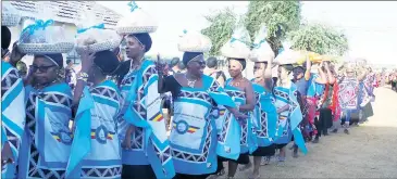  ?? ?? Lutsango from Royal Eswatini National Airways Corporatio­n dancing as they deliver their gifts on Friday to Their Majesties.