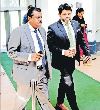  ?? Picture: JONA KONATACI ?? Minister for Industrial Relations, Employment, Productivi­ty, Youth and Sports, Parveen Kumar (left) with Attorney-General Aiyaz Sayed-Khaiyum during a break at Parliament yesterday.