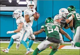  ?? CHARLES TRAINOR JR./MIAMI HERALD/TNS ?? After playing as a sub lastweek, Dolphins quarterbac­k Tua Tagovailoa will get his first big test of his surgically repaired hip today.
