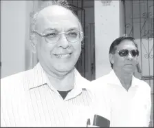  ??  ?? Flashback October 2012: Steve Ferguson and Ishwar Galbarsing­h leave the Port-of-Spain Magistrate­s’ Court on St Vincent Street, Port-of-Spain.