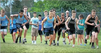  ?? GENE WALSH — DIGITAL FIRST MEDIA ?? Runners take off at the start of cross country meet at North Penn Monday.