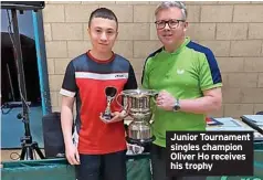  ?? ?? Junior Tournament singles champion Oliver Ho receives his trophy