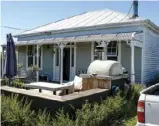  ??  ?? The same house showing the pizza oven made by the son of the family as a school project with help from his dad