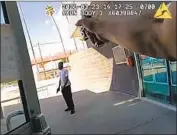  ?? Los Angeles Police Department ?? LOS ANGELES Police Department video shows a man holding an imitation gun outside the LAPD’s Olympic station before being shot by an officer.