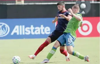  ?? JOHN RAOUX/AP ?? The Fire’s Mauricio Pineda, who scored his first MLS goal, battles the Sounders’ Jordan Morris.