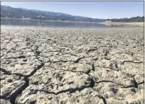  ?? HAVEN DALEY — THE ASSOCIATED PRESS ?? An exposed dry bed is seen at Lake Mendocino near Ukiah, Calif. on Aug. 4, 2021.