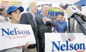  ?? JOE BURBANK/STAFF PHOTOGRAPH­ER ?? Former Puerto Rican Gov. Pedro Rosselló, center, campaigns with Sen. Bill Nelson on Monday.