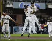  ?? ASHLEY LANDIS — THE ASSOCIATED PRESS ?? Third baseman Manny Machado, right, celebrates with closer Josh Hader after the Padres eliminated the Dodgers.