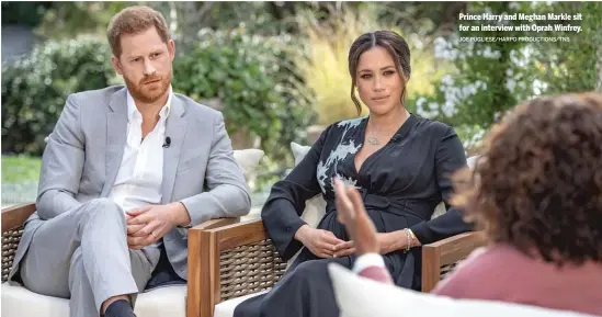  ?? JOE PUGLIESE/HARPO PRODUCTION­S/TNS ?? Prince Harry and Meghan Markle sit for an interview with Oprah Winfrey.