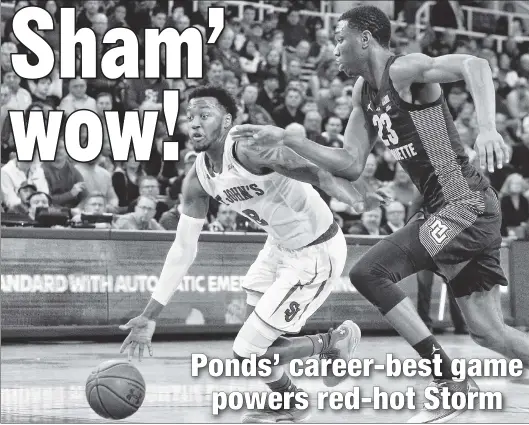  ?? Paul J. Bereswill ?? PONDS’ BIG SPLASH: Shamorie Ponds drives past Jamal Cain of Marquette on his way to a career-best 44 points — fourth most in St. John’s history — in the Red Storm’s third straight win, 86-78 in front of a raucous crowd (below) Saturday at Carnesecca...