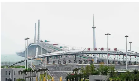  ?? — Reuters ?? Major connection: A general view of the 55km Hong Kong-Zhuhai-Macau bridge after its opening ceremony in Zhuhai.