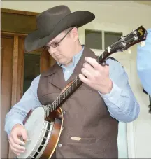  ??  ?? Austin Butler picks the banjo.