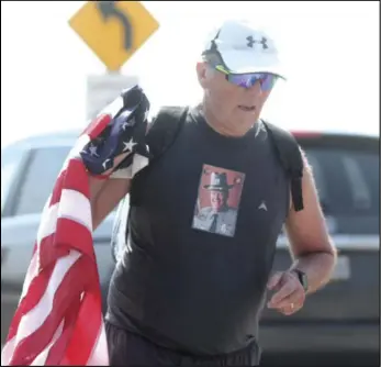  ?? EL File Photo ?? Rod Carpenter nears the finish line during his Marathon VI: Lots for Soldiers race in 2020. Carpenter ran the marathon in memory of Sgt. Douglas Springer, who was a 20-year veteran with the Coldwater PD and died from suffering a heart attack while on duty in 1996.