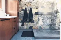  ?? MARVIN JOSEPH THE WASHINGTON POST ?? The Sergents’ redesigned ensuite bathroom has a shower with a natural stone wall and a porcelain floor that resembles slate.