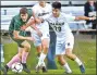  ?? Peter Hvizdak / Hearst Connecticu­t Media ?? Devlin Ahlefeld of Guilford High School, left, seen earlier this season, scored the winner with under five minutes left to lift Guilford to a 10 win over Cheshire.