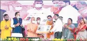  ?? SOURCED ?? CM Yogi Adityanath giving certificat­e to a beneficiar­y of a government scheme in Bahraich on Saturday. .