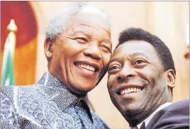  ?? Picture: REUTERS ?? Nelson Mandela and Brazilian soccer legend Pele smile for photograph­ers at Union Buildings in Pretoria, South Africa.