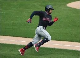  ?? The Associated Press ?? Cleveland Indians’ Francisco Lindor runs after hitting a double against the Chicago White Sox during the fourth inning of an Aug. 8 game in Chicago. The Cleveland Indians have agreed to trade four-time All-Star shortstop Francisco Lindor and pitcher Carlos Carrasco to the New York Mets, a person with direct knowledge of the deal told the Associated Press on Thursday.