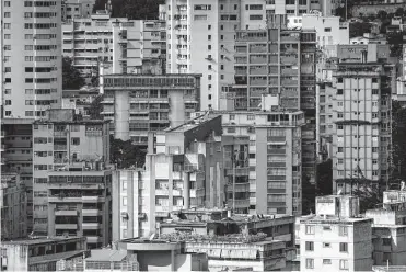  ?? Matias Delacroix/associated Press ?? Buildings stand in Caracas, Venezuela. The nation, which has the largest oil reserves in the world, needs to find foreign investors after years of chronic underinves­tment by state-owned Petróleos de Venezuela.