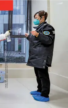  ??  ?? VIRUS HANDLERS
The tools of modern genomics make it possible to identify and sequence the genetic code of a new pathogen in a matter of days. Top: Scientists work in a lab in Tauizhou City, China, to develop ways of detecting the new virus. Left: health workers disinfect ambulance staff at a hospital in Wuhan.