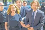  ?? AFP ?? Felicity Huffman and husband William H Macy at the court.