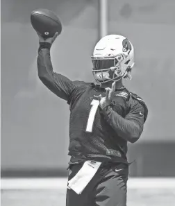  ??  ?? Cardinals quarterbac­k Kyler Murray passes during practice at the team’s training facility in Tempe on Tuesday.