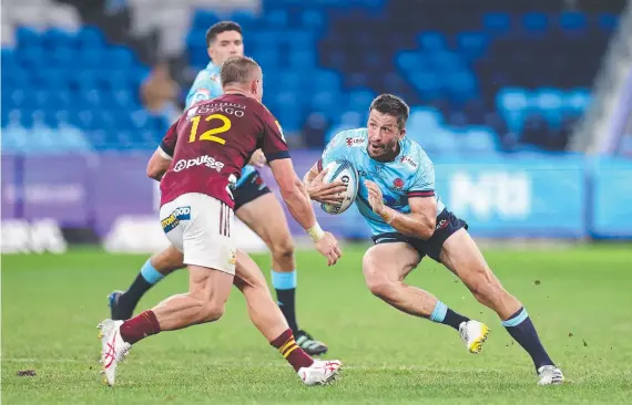  ?? Picture: Cameron Spencer/getty Images ?? Jake Gordon of the Waratahs runs the ball during the round 10 Super Rugby Pacific match against the Highlander­s earlier this year.