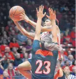 ?? JIM THOMPSON/ JOURNAL ?? UNM’s Aisia Robertson takes the ball to the basket as San Diego State’s Loli Gomez (23) defends during the Lobos’ win over the Aztecs Wednesday.