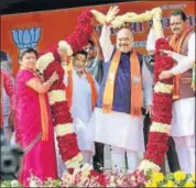  ?? PTI PHOTO ?? BJP national president Amit Shah is garlanded at a public meeting in Bhavnagar, Gujarat, on Tuesday.