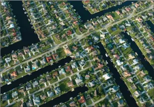  ??  ?? Cape Coral has 400 miles of man-made canals, offering nearly everyone ‘waterfront’ property.