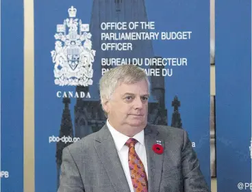  ?? ADRIAN WYLD / THE CANADIAN PRESS ?? Parliament­ary budget officer Jean-Denis Frechette found that close to 33,000 families could pay more taxes because of the income-sprinkling rule that came into effect Jan. 1.