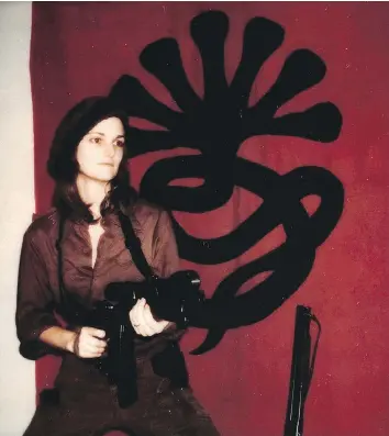  ?? THE ASSOCIATED PRESS/FILES ?? Patty Hearst, seen in 1974 during her time with the Symbionese Liberation Army, is the subject of Jeffrey Toobin’s new book, which also highlights the unrest affecting the U.S. in the ’70s.