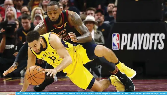  ??  ?? CLEVELAND: Cory Joseph #6 of the Indiana Pacers dives for the ball in front of LeBron James #23 of the Cleveland Cavaliers during the second half Game One of the Eastern Conference Quarterfin­als during the 2018 NBA Playoffs at Quicken Loans Arena on...