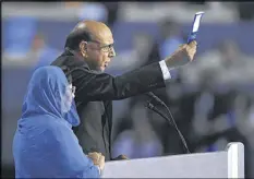  ?? MARK J. TERRILL / AP ?? Khizr Khan, father of fallen U.S. Army Capt. Humayun Khan, holds up his copy of the Constituti­on as he speaks at the Democratic National Convention.