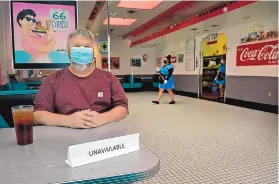  ?? JIM THOMPSON/ JOURNAL ?? John Warble, general manager of the 66 Diner, sits at an indoor table at the restaurant. Starting Saturday, the restaurant will be able to seat customers at 25% capacity.