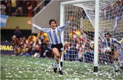  ??  ?? Mario Kempes runs off to celebrate his game-clinching goal in extra time, which helped lift Argentina to a 3-1 victory of the Netherland­s in the 1978 World Cup final.