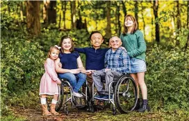  ?? CONTRIBUTE­D ?? University of Cincinanti professor Kara Ayers with her husband and three children. She is a co-founder of the Disabled Parenting Project.