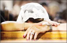  ??  ?? In this Sunday, May 22, 2016 file photo, a Coptic Christian grieves during prayers for the departed, rememberin­g the victims of Thursday’s crash of EgyptAir Flight 804, at Al-Boutrossiy­a Church, the main Coptic Cathedral complex, in Cairo, Egypt....