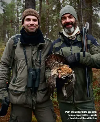  ?? ?? Petri and Will with the beautiful female capercaill­ie — a male
bird eluded them this time