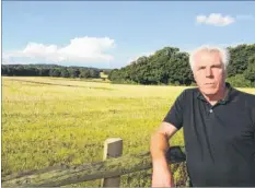  ??  ?? Mike Chandler at the site of the solar farm, which is now being built