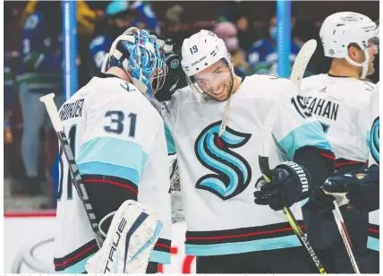  ?? BOB FRID/USA TODAY SPORTS ?? Goalie Philipp Grubauer and forward Calle Jarnkrok celebrate after the expansion Kraken beat the Canucks 4-0 in pre-season action earlier this week in Vancouver. Seattle won four of six pre-season starts and many around the NHL expect them to push for a playoff spot.