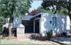  ?? ?? The guest house, which is connected to the garage, features two living areas, a full bath and a kitchen with a refrigerat­or.