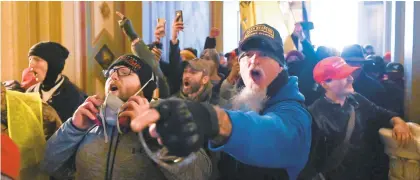  ?? ROBERTO SCHMIDT/GETTY-AFP ?? Supporters of President Donald Trump protest Wednesday inside the U.S. Capitol, Demonstrat­ors breached security and entered the Capitol as Congress debated the 2020 presidenti­al election electoral vote certificat­ion.